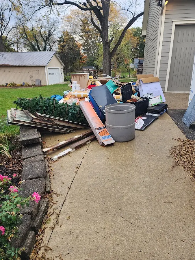 Dumpster being loaded with debris for 3 Yard Dumpster Rental in Galena